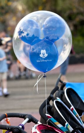 stroller with mickey balloon at disney