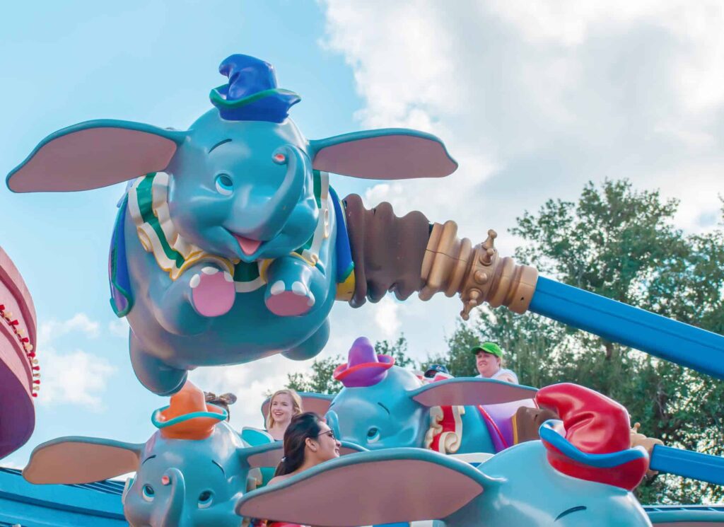Dumbo the Flying Elephant ride in action with people at Magic Kingdom
