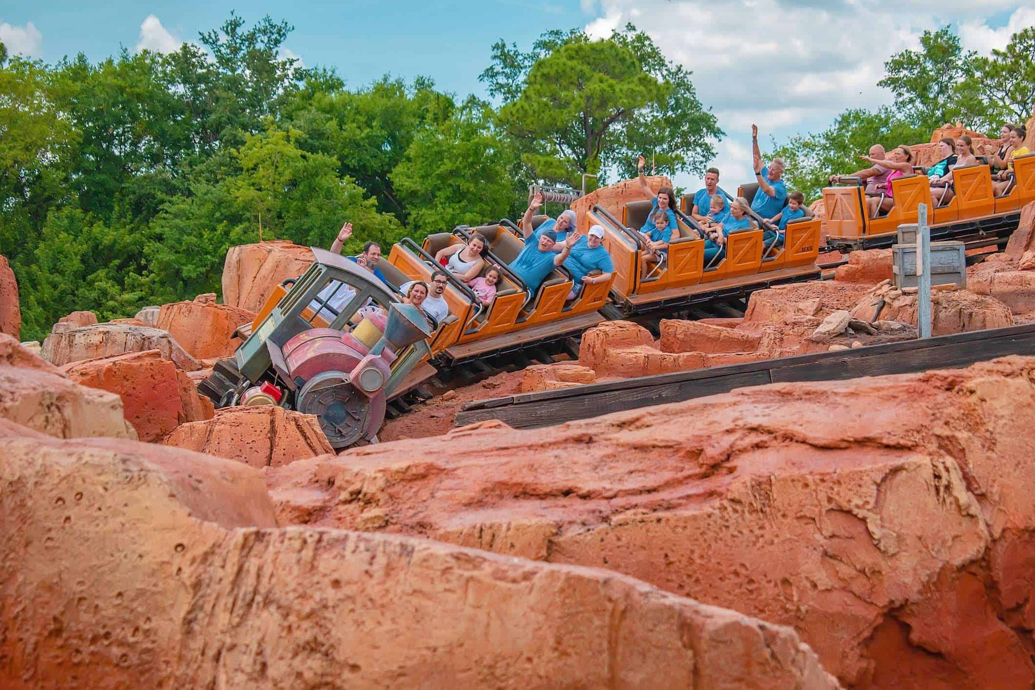 People riding Big Thunder Mountain Railroad at Magic Kingdom