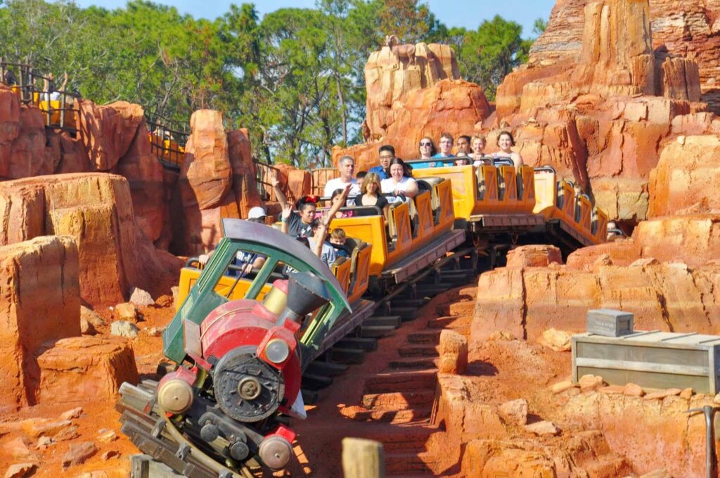 picture of people riding Big Thunder Mountain Railroad at Magic Kingdom