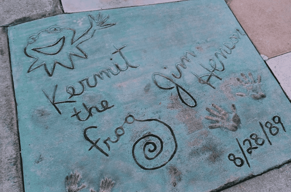 Sidewalk tile with Kermit the Frog and Jim Henson signature and handprints dated 1989 at Hollywood Studios in Walt Disney World.