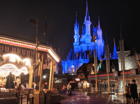 An empty Fantasyland taken at night behind Cinderella Castle.
