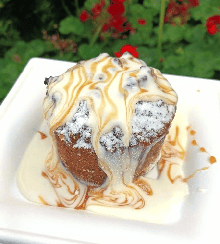 Caramel drizzle and sweet icing top a warm Pretzel Bread Pudding from Sommerfest in the Germany Pavilion, EPCOT.
