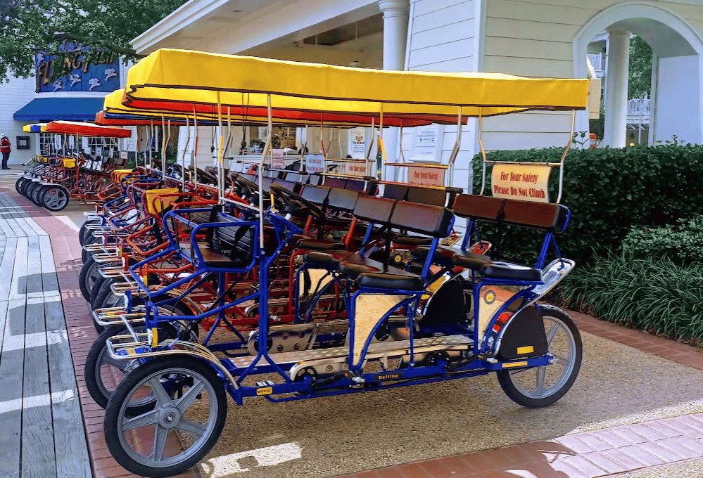 Colorful Surrey bikes available for rent at Disney's BoardWalk Inn Resort.