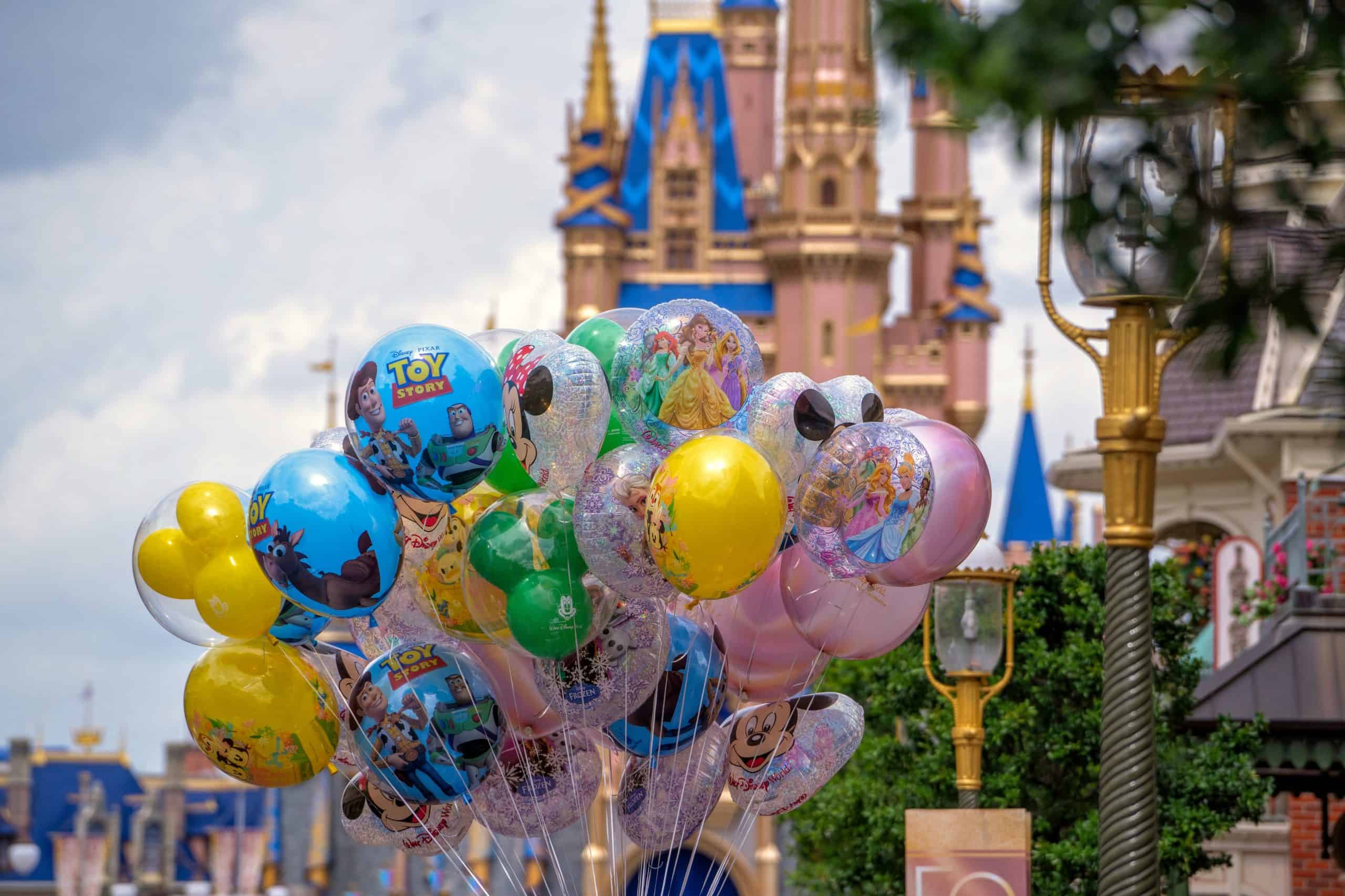 photo of big bunch of balloons with Cinderella Castle in background at Magic Kingdom