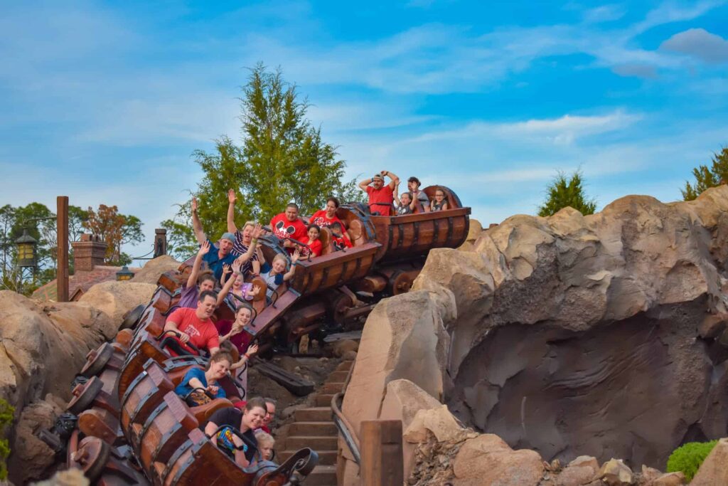 People riding on Seven Dwarfs Mine Train ride at Magic Kingdom