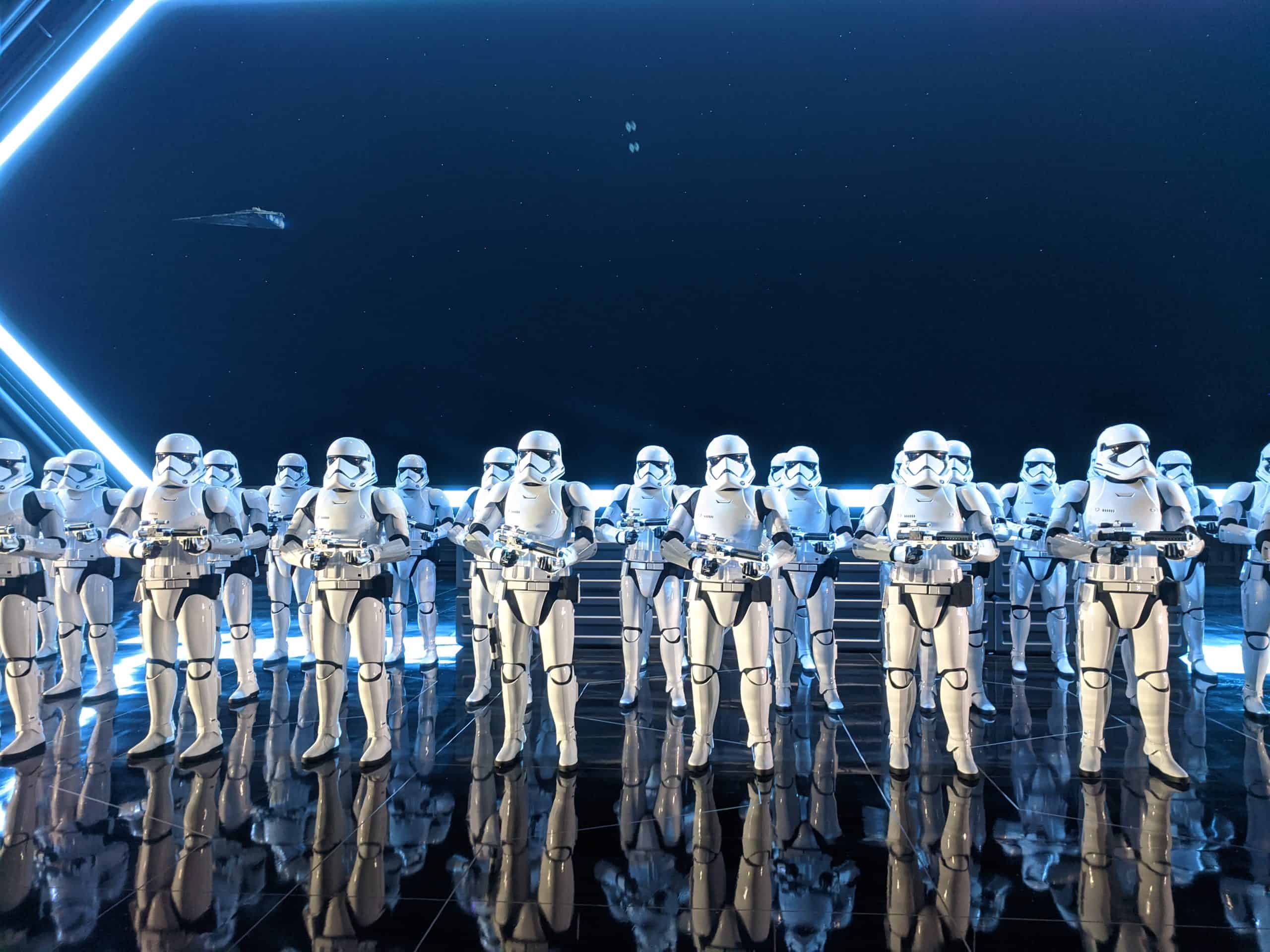 Multiple Stormtroopers in room with cosmic background