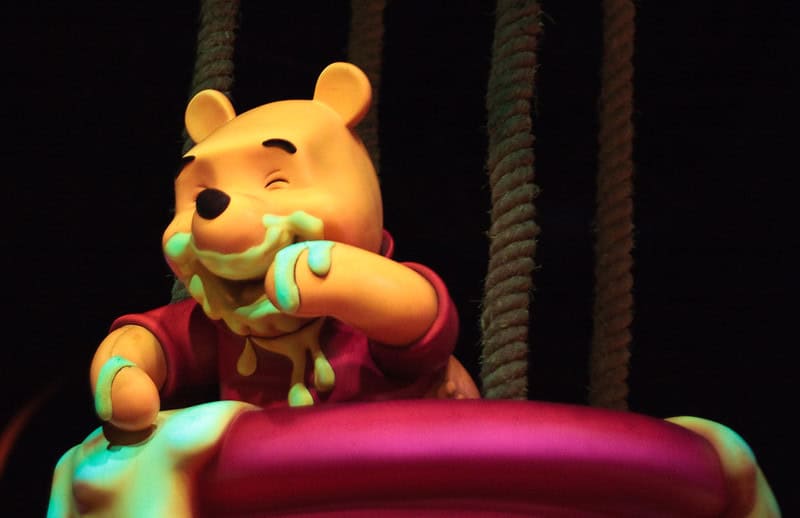 Photo of Winnie the Pooh figure eating honey on ride at Disneyland