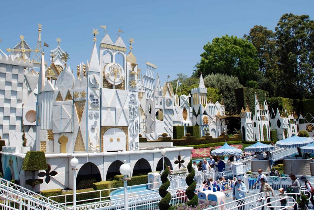 it's a small world Disneyland with queue and outdoor entrance on sunny day